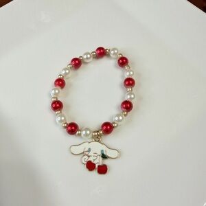 Red and White Beaded Bracelet with Sanrio Cinnamoroll Cherry Charm